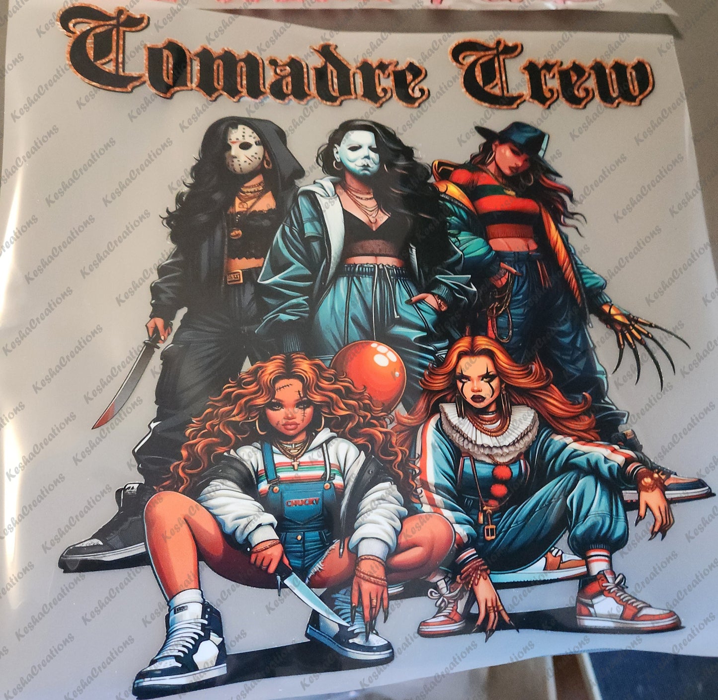 DTF transfer design featuring five women dressed as iconic horror characters, labeled 'Comadre Crew' at the top. The characters wear distinct horror-inspired outfits with various props like a knife, red balloon, and Freddy Krueger's glove, all standing in a fierce group pose.